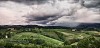 Clouds over a green landscape