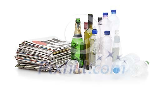 Newspapers and plastic bottles on a white background