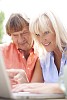 Couple typing on the laptop