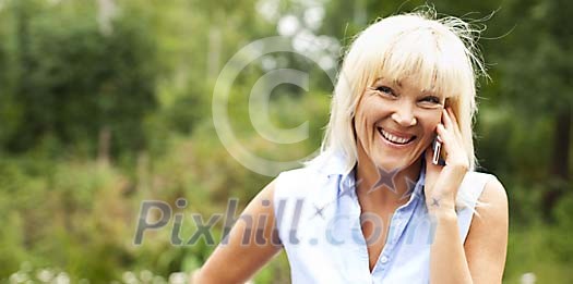 Woman smiling while on the phone Woman smiling while on the phone