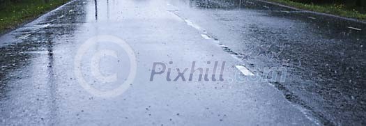 Raindrops on a wet asphalt