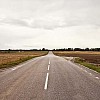 Empty road between fields