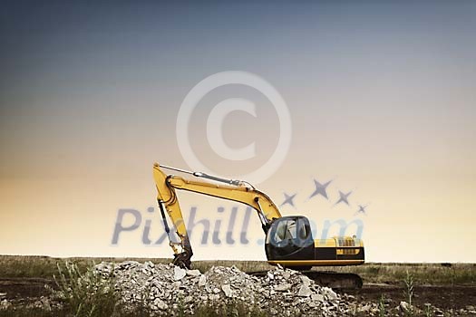 Excavator on a field