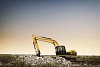 Excavator on a field