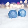 Blue christmas balls on the snow
