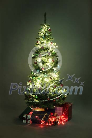 Gifts under the illuminated christmas tree