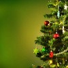 Decorated christmas tree on a green background