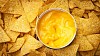 Background of nachos with cheese sauce