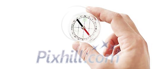 Isolated hand holding a see-through compass