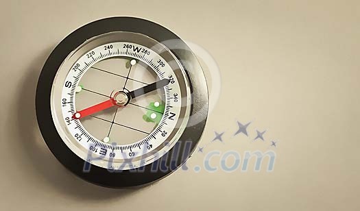 Compass on a grey background