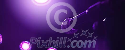 Microphone on a illuminated stage Microphone on a illuminated stage