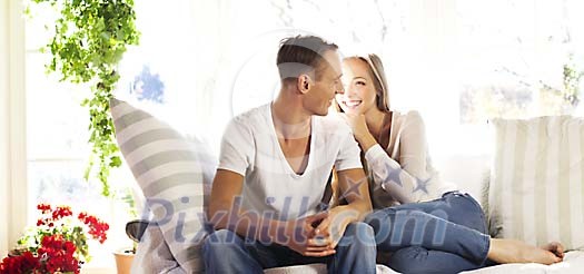 Young couple sitting on the sofa