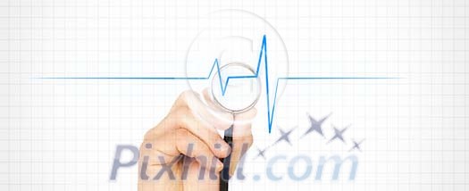 Hand holding a stetoscope on a heartbeat line