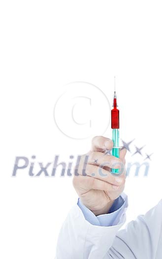 Hand holding a syringe filled with red fluid