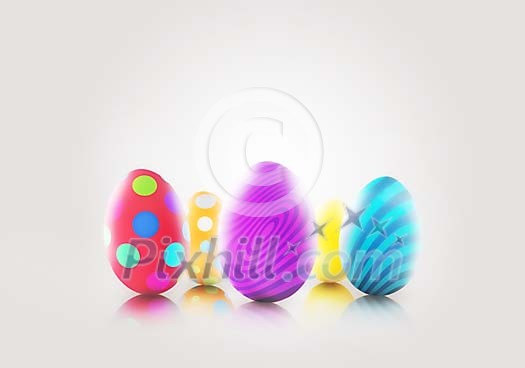 Striped and spotted Easter eggs on a neutral background with copyspace Striped and spotted Easter eggs on a neutral background with copyspace