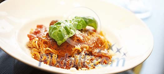Spaghetti Bolognese with parmesan and basil leafs Spaghetti Bolognese with parmesan and basil leafs