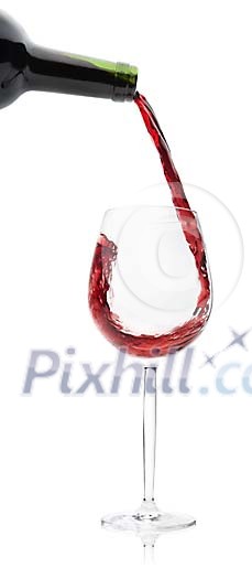 Wine glass being fulled with red wine