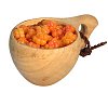Golden berries from the forests of Lapland in a wooden cup