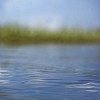 Very shallow focus on waves of finnish lake water