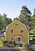 Wooden house with mansard roof