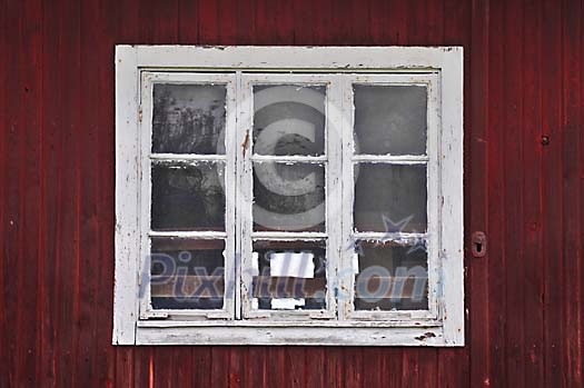 Old, rustic window with white frames