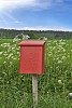Red mailbox on countryside