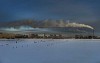 Smoking factory chimney in winter