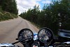 Speeding motorcycle on a forest road