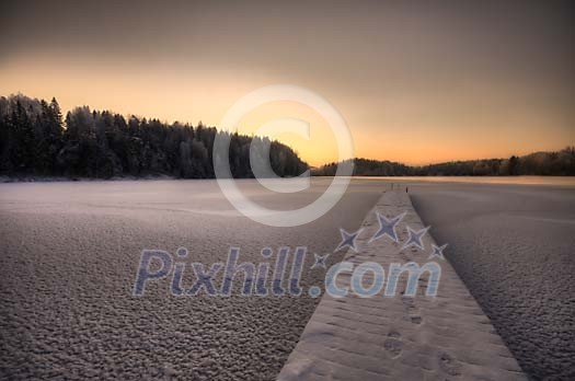 Snowy trail on a frozen lake Snowy trail on a frozen lake