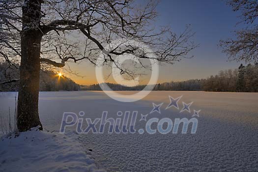 Frozen lake at the sunset