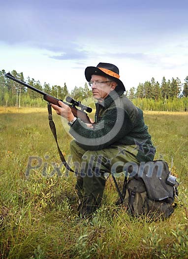 Hunter sitting on a backbag, waiting Hunter sitting on a backbag, waiting