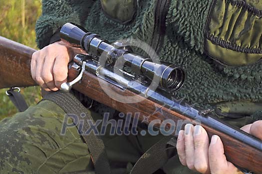 Hunter holding a rifle