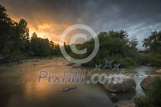 River flowing at the sunset
