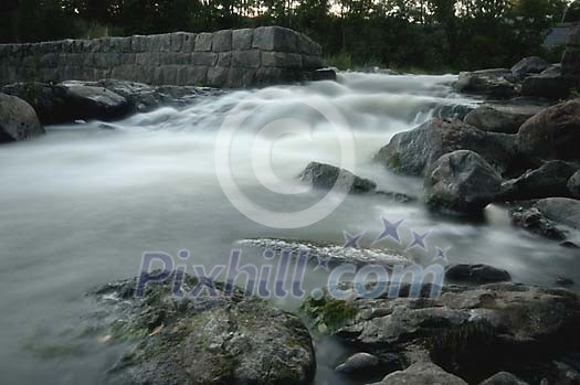 Water rushing down from a little waterfall