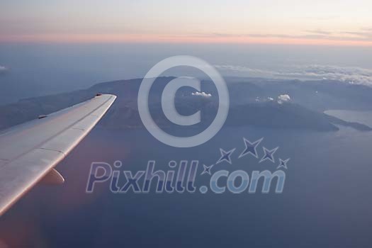 Plane wing over the island Plane wing over the island