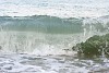 Big wave reaching the beach