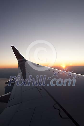 Aeroplane wing on the sunset Aeroplane wing on the sunset