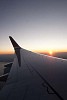 Aeroplane wing on the sunset