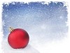 A red christmas ball lying on snow with a snowy background
