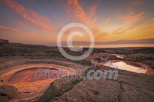 Dead Sea sinkholes at the sunset