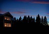 Lighted house in the evening dusk