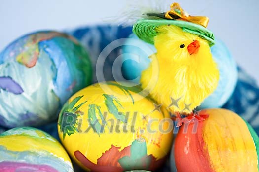 Painted easter eggs with a decorative chick Painted easter eggs with a decorative chick