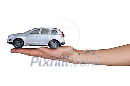 Isolated hand holding a toy car Isolated hand holding a toy car