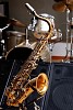Saxophone infront of drums and speaker