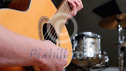 Human playing a guitar