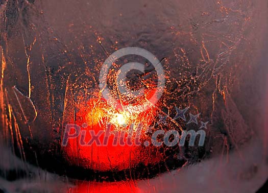 Candle light through ice wall