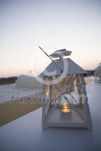 Lantern wit a burning candle outside Lantern wit a burning candle outside