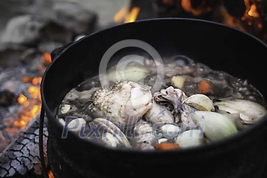 Soup being cooked on an open fire Soup being cooked on an open fire