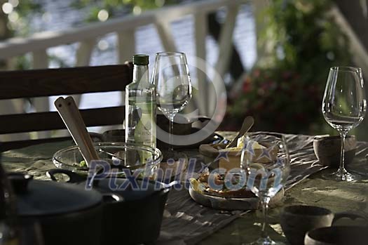 Outside table setted for evening dinner Outside table setted for evening dinner