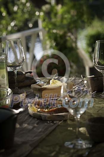 Outside table setted for evening meal Outside table setted for evening meal